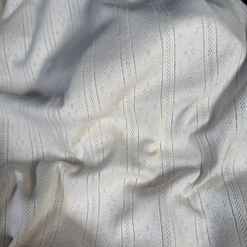 Organic Cotton Whispering Lines Pointelle Knit Fabric In Cotton Cream 1