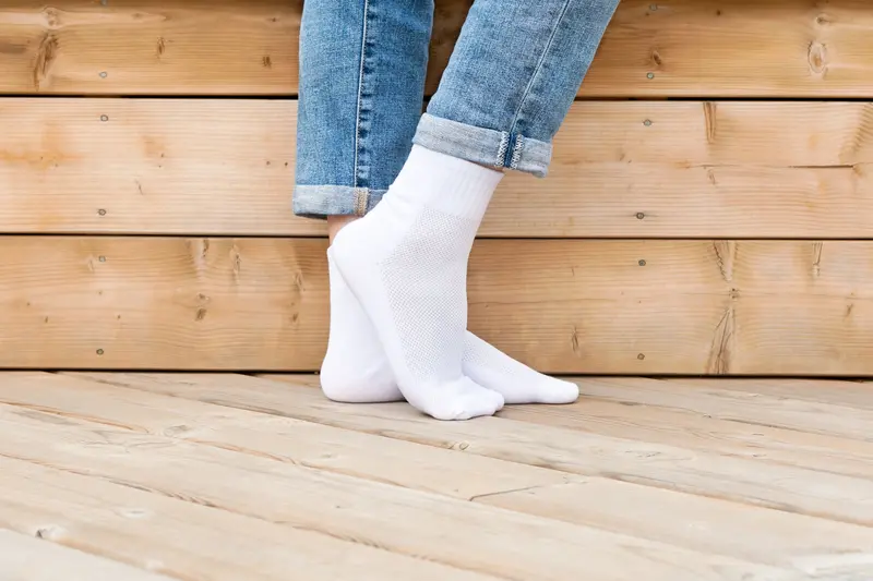 White Athletic Sock Featuring Foot Pose Graphic 1